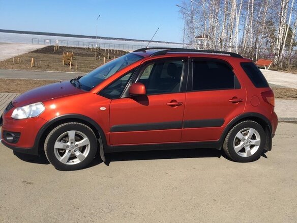 2011 Suzuki SX4 I (Classic) Рестайлинг, оранжевый - вид 3