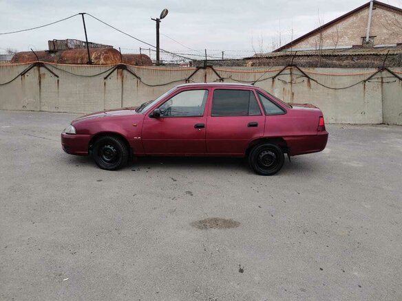 2009 Daewoo Nexia I Рестайлинг, красный - вид 4