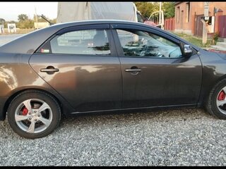 2010 Kia Cerato 5-speed II, коричневый, 505000 рублей, вид 2