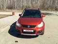 2011 Suzuki SX4 I (Classic) Рестайлинг, оранжевый - вид 1