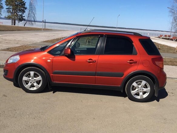 2011 Suzuki SX4 I (Classic) Рестайлинг, оранжевый - вид 4
