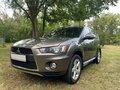 2012 Mitsubishi Outlander II Рестайлинг, коричневый, 1390000 рублей - вид 2