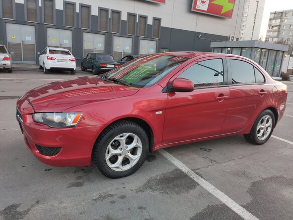 2008 Mitsubishi Lancer X, красный - вид 1