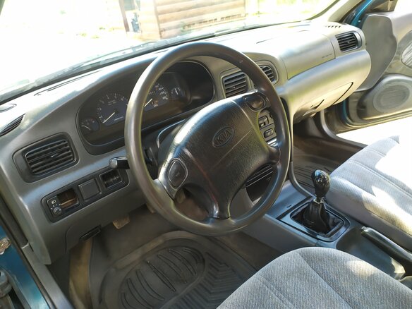 1999 Kia Clarus II, зелёный, 104437 рублей - вид 7