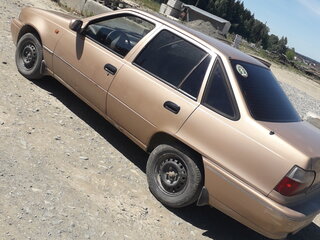 2001 Daewoo Nexia I, бежевый, 60000 рублей, вид 1