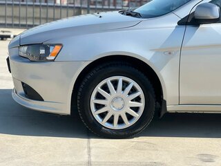 2014 Mitsubishi Lancer X Рестайлинг, серебристый, 920010 рублей, вид 2