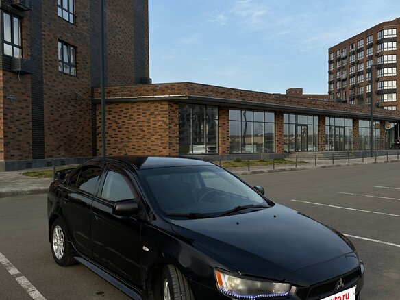 2010 Mitsubishi Lancer X, чёрный, 720000 рублей - вид 1