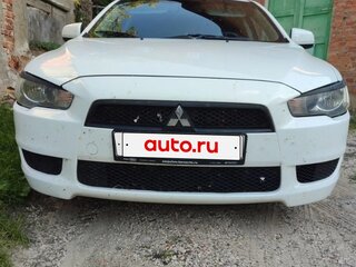 2009 Mitsubishi Lancer X, белый, 655000 рублей, вид 1