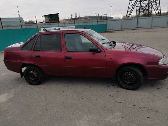 2009 Daewoo Nexia I Рестайлинг, красный - вид 2