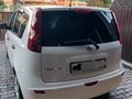 2013 Nissan Note I Рестайлинг, белый, 999000 рублей - вид 4