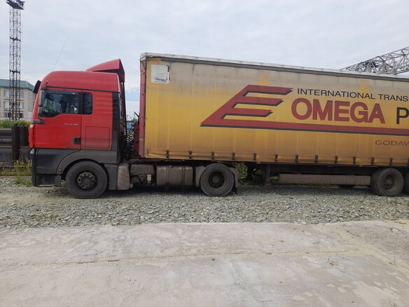 2007 MAN TGA, красный, 2100000 рублей - вид 2