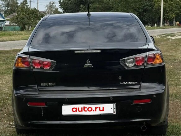 2010 Mitsubishi Lancer X, чёрный, 550000 рублей - вид 1