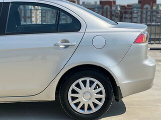 2014 Mitsubishi Lancer X Рестайлинг, серебристый, 920010 рублей, вид 4