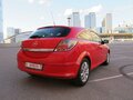 2010 Opel Astra GTC H Рестайлинг, красный, 570000 рублей - вид 4