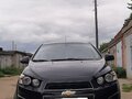 2012 Chevrolet Aveo II, чёрный, 700000 рублей - вид 2