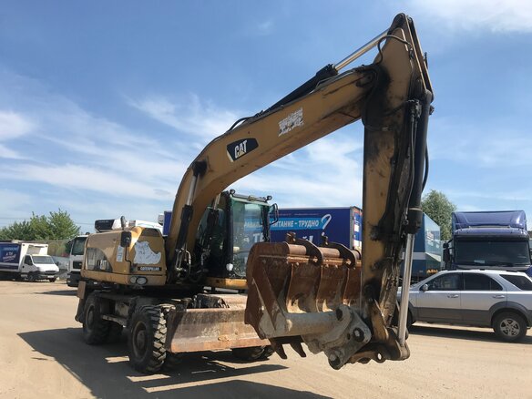 2013 Caterpillar M317, жёлтый - вид 1
