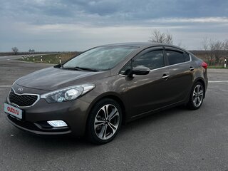 2016 Kia Cerato III Рестайлинг (Classic), коричневый, 1450000 рублей, вид 1