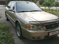 2004 Kia Magentis I Рестайлинг, бежевый - вид 1