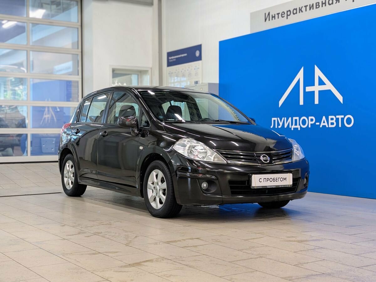 Открыть фотографии: Nissan Tiida I Рестайлинг