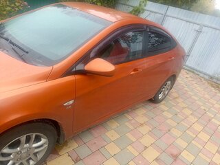 2015 Hyundai Solaris I Рестайлинг, оранжевый, 650000 рублей, вид 4