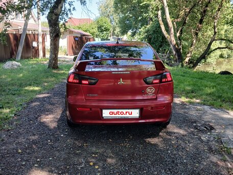 2010 Mitsubishi Lancer X, красный, 615000 рублей, вид 4