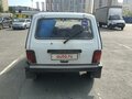 2011 Lada (ВАЗ) 2121 (4x4) I Рестайлинг, белый, 900000 рублей - вид 2