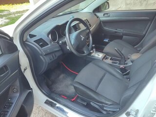 2009 Mitsubishi Lancer X, белый, 655000 рублей, вид 5