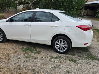 2014 Toyota Corolla XI (E160, E170, E180), белый, 1350000 рублей, вид 4