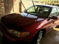 1996 Ford Escort (North America) III, красный - вид 6