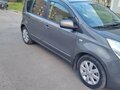 2010 Nissan Note I Рестайлинг, серый, 610000 рублей - вид 1