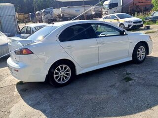 2011 Mitsubishi Lancer X Рестайлинг, белый, 720000 рублей, вид 2