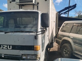 1991 Isuzu Elf (N-series), бежевый, 425000 рублей, вид 1