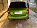 2011 Skoda Fabia II Рестайлинг, зелёный - вид 1