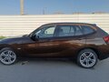 2011 BMW X1 18i I (E84), коричневый, 1500000 рублей