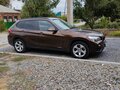 2013 BMW X1 20i I (E84) Рестайлинг, коричневый, 1360000 рублей