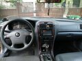 2004 Kia Magentis I Рестайлинг, бежевый - вид 7