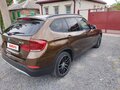 2013 BMW X1 20i I (E84) Рестайлинг, коричневый, 1360000 рублей - вид 7