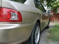 2004 Kia Magentis I Рестайлинг, бежевый - вид 3