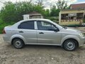 2011 Chevrolet Aveo I Рестайлинг, серебристый, 560000 рублей - вид 2