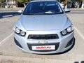 2014 Chevrolet Aveo II, серебристый, 600000 рублей