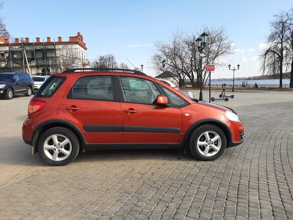 2011 Suzuki SX4 I (Classic) Рестайлинг, оранжевый - вид 3