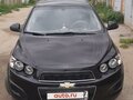 2012 Chevrolet Aveo II, чёрный, 700000 рублей - вид 1
