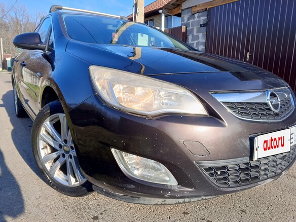 2012 Opel Astra J Рестайлинг, коричневый, 800000 рублей - вид 9