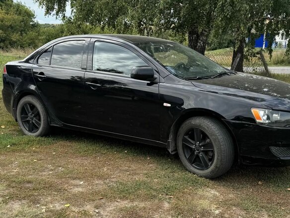 2010 Mitsubishi Lancer X, чёрный, 550000 рублей - вид 3