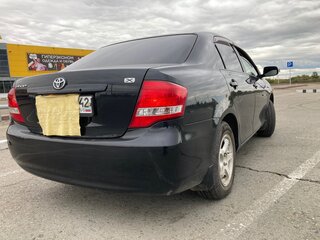 2009 Toyota Corolla Axio X (E140, E150) Рестайлинг, чёрный, 800000 рублей, вид 3