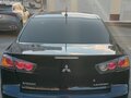 2010 Mitsubishi Lancer X, чёрный, 620000 рублей - вид 2