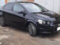 2012 Chevrolet Aveo II, чёрный, 700000 рублей