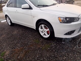 2013 Mitsubishi Lancer X Рестайлинг, белый, 749000 рублей, вид 1