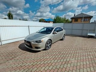 2011 Mitsubishi Lancer X Рестайлинг, бежевый, 600000 рублей, вид 1
