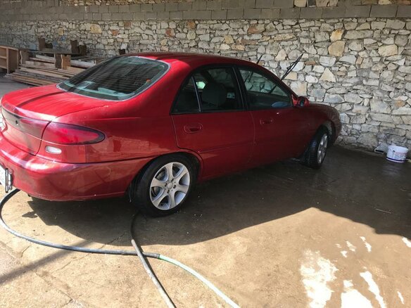1996 Ford Escort (North America) III, красный - вид 3